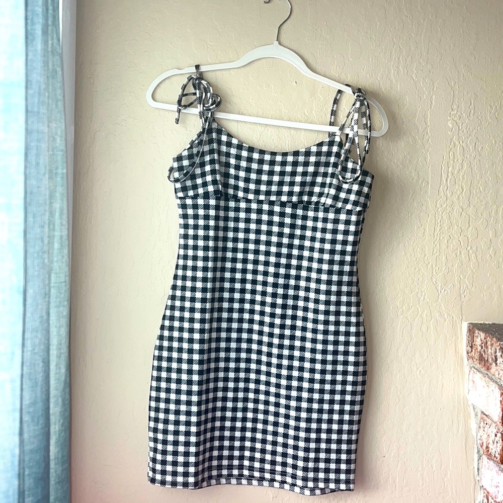 Black and white checkered women’s juniors dress. From SHEIN in a size M.